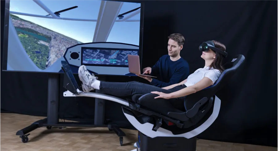 Pascal Jansen supervising a student in an immersive simulator